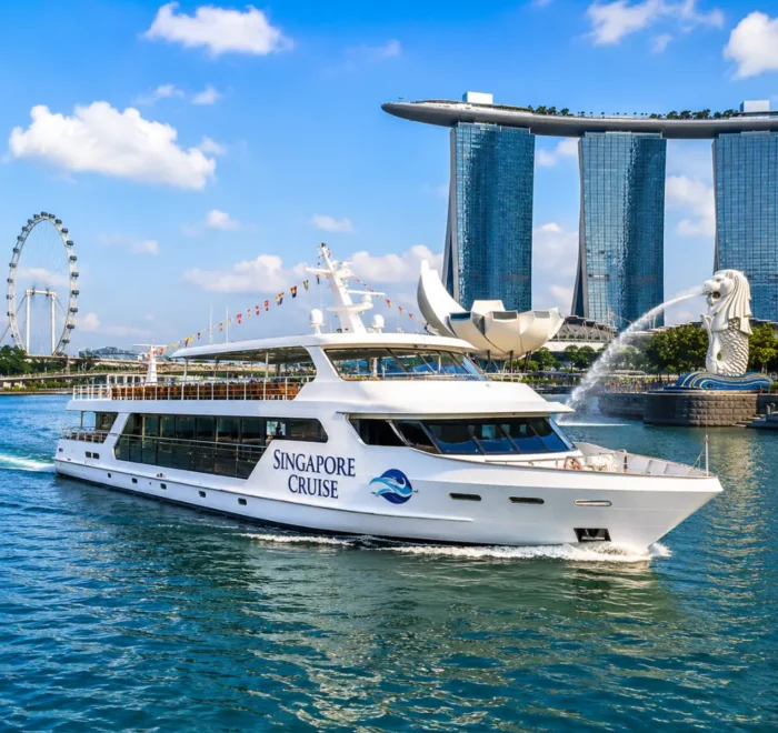 Luxury Singapore cruise ship near Marina Bay with skyline, blue water, and bright morning travel atmosphere.