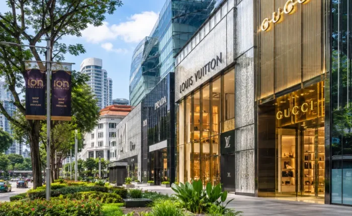 Luxury shopping street in Singapore with Marina Bay style skyline, designer stores, and bright morning atmosphere.