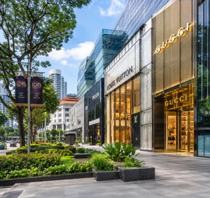 Luxury shopping street in Singapore with Marina Bay style skyline, designer stores, and bright morning atmosphere.