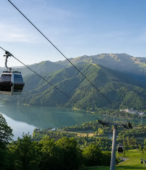 Gabala Azerbaijan mountain landscape with cable car, green valleys, calm lake, and bright morning atmosphere