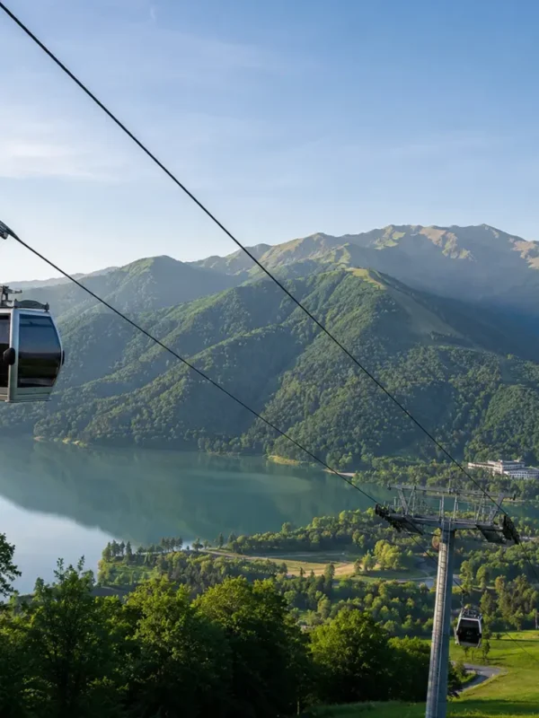 Gabala Azerbaijan mountain landscape with cable car, green valleys, calm lake, and bright morning atmosphere