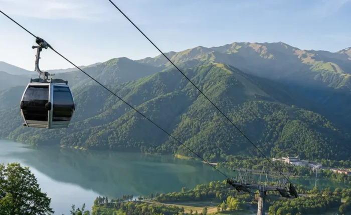 Gabala Azerbaijan mountain landscape with cable car, green valleys, calm lake, and bright morning atmosphere
