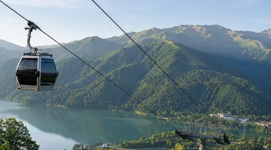 Gabala Azerbaijan mountain landscape with cable car, green valleys, calm lake, and bright morning atmosphere