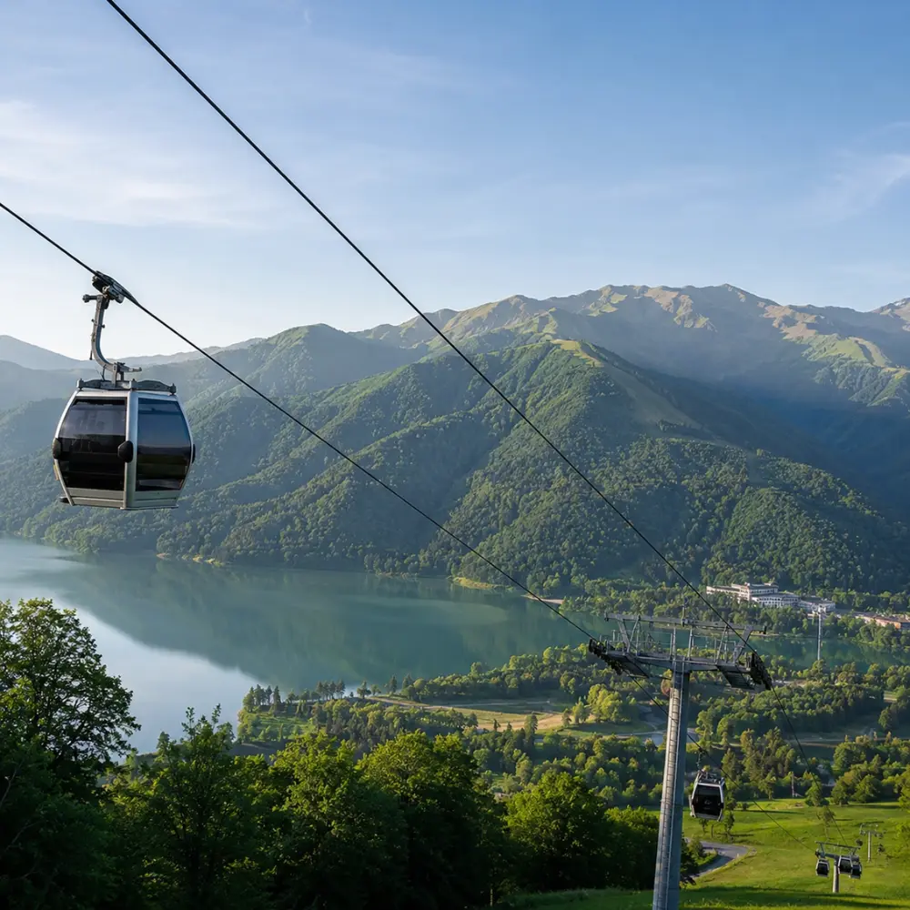 Gabala Azerbaijan mountain landscape with cable car, green valleys, calm lake, and bright morning atmosphere