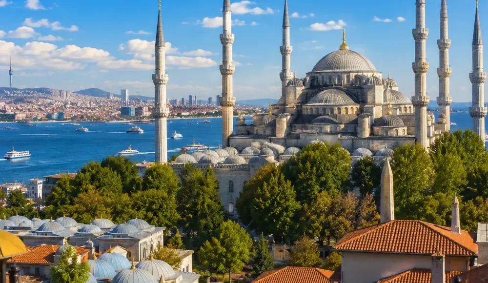 Istanbul skyline with Hagia Sophia, Blue Mosque, Bosphorus views, historic domes, and bright morning atmosphere