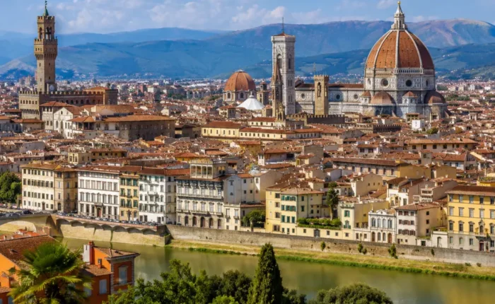 Florence Italy with Duomo cathedral, historic rooftops, Arno River views, and bright morning European atmosphere.