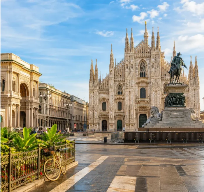 Milan Italy with Duomo Cathedral, elegant city square, luxury shopping streets, and bright morning atmosphere.