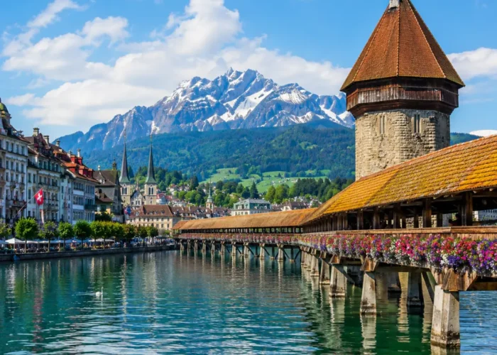 Lucerne city tour with Chapel Bridge, Lake Lucerne, Swiss Alps, historic buildings, and bright morning atmosphere.