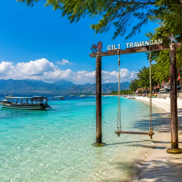 Gili Trawangan Indonesia with turquoise beach, clear sea, tropical palms, and bright morning island atmosphere.