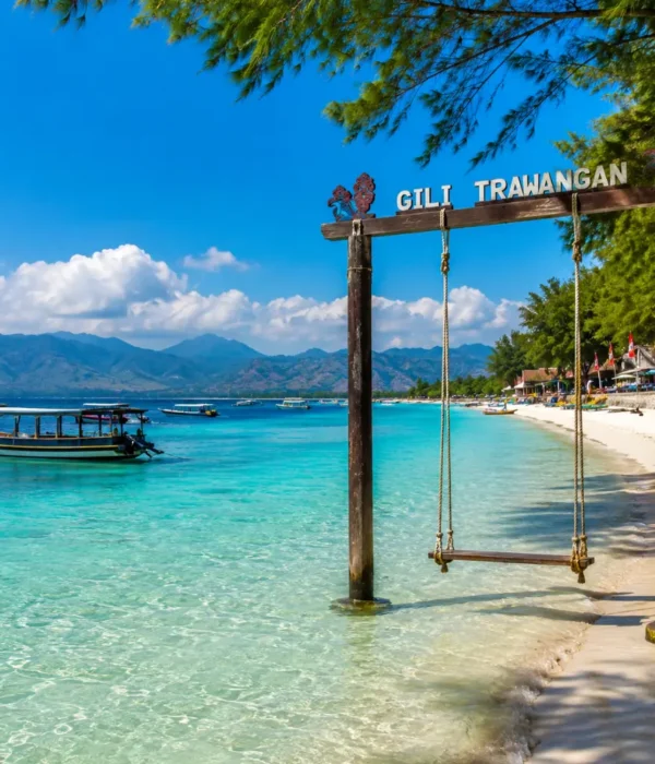 Gili Trawangan Indonesia with turquoise beach, clear sea, tropical palms, and bright morning island atmosphere.