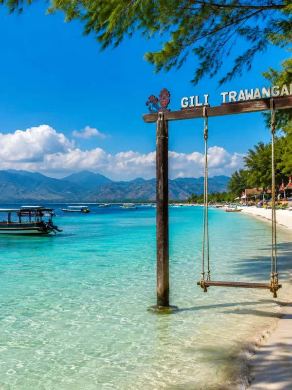 Gili Trawangan Indonesia with turquoise beach, clear sea, tropical palms, and bright morning island atmosphere.
