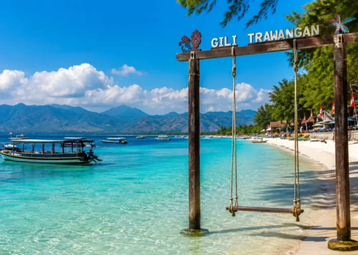 Gili Trawangan Indonesia with turquoise beach, clear sea, tropical palms, and bright morning island atmosphere.
