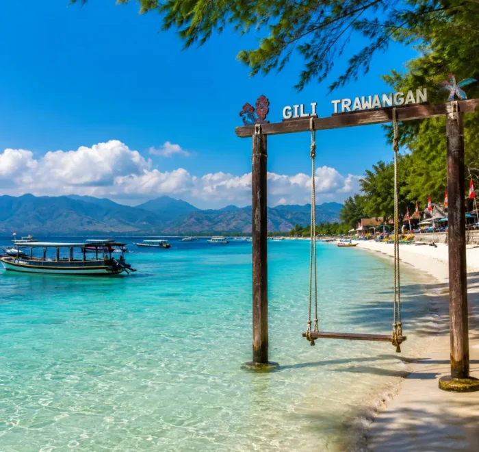 Gili Trawangan Indonesia with turquoise beach, clear sea, tropical palms, and bright morning island atmosphere.