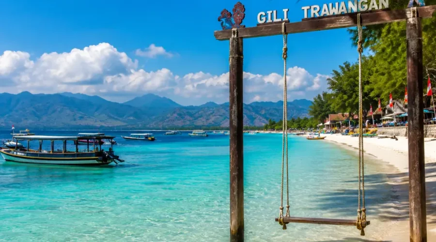 Gili Trawangan Indonesia with turquoise beach, clear sea, tropical palms, and bright morning island atmosphere.