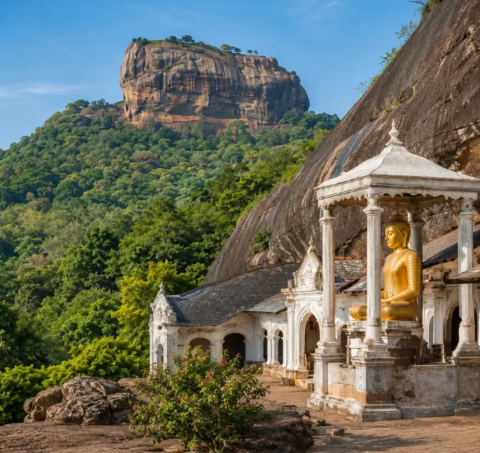 A breathtaking view of Sigiriya Rock Fortress rising dramatically above lush green forests alongside the ancient Dambulla Cave Temple with its golden Buddha statue, showcasing Sri Lanka's rich cultural heritage under a bright blue daytime sky.