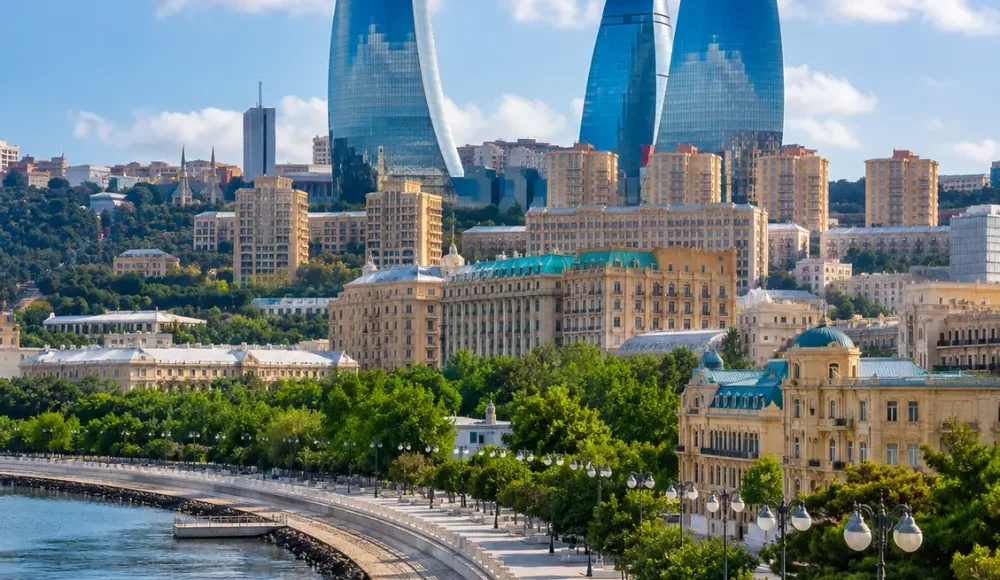 Baku city skyline with Flame Towers, Caspian Sea Boulevard, modern architecture, and bright morning atmosphere.