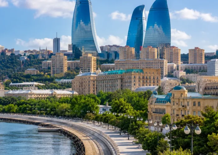 Baku city skyline with Flame Towers, Caspian Sea Boulevard, modern architecture, and bright morning atmosphere.
