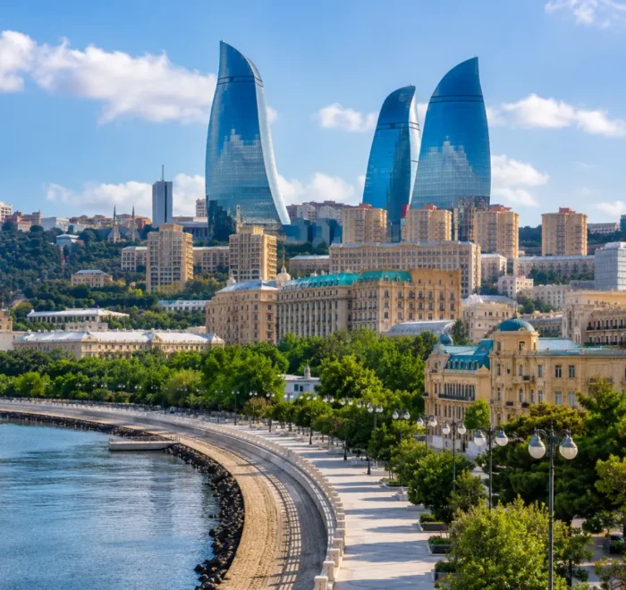Baku city skyline with Flame Towers, Caspian Sea Boulevard, modern architecture, and bright morning atmosphere.