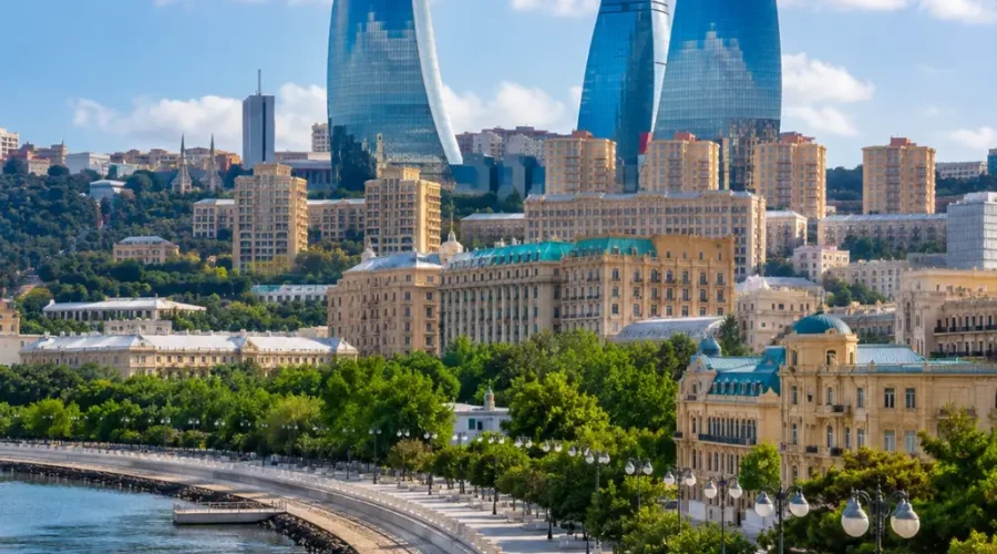 Baku city skyline with Flame Towers, Caspian Sea Boulevard, modern architecture, and bright morning atmosphere.