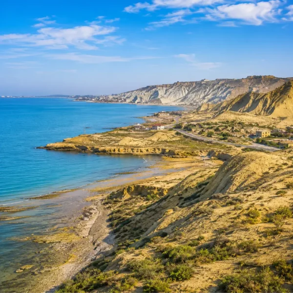 Absheron Peninsula in Azerbaijan with Ateshgah fire temple, rocky landscape, clear sky, and bright morning light.