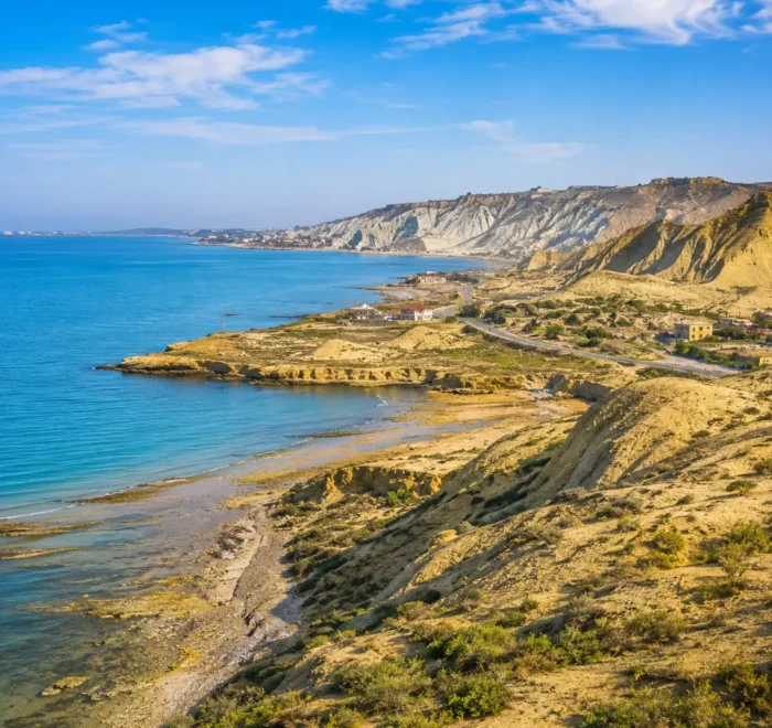 Absheron Peninsula in Azerbaijan with Ateshgah fire temple, rocky landscape, clear sky, and bright morning light.