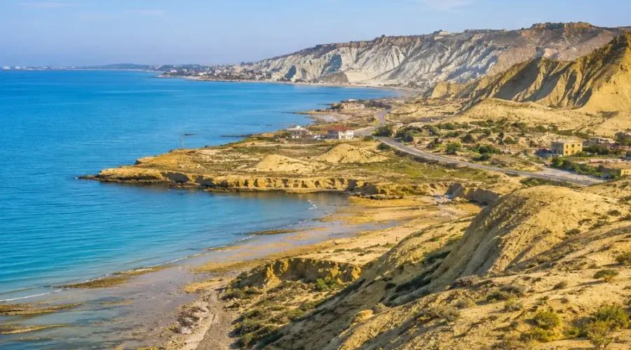 Absheron Peninsula in Azerbaijan with Ateshgah fire temple, rocky landscape, clear sky, and bright morning light.
