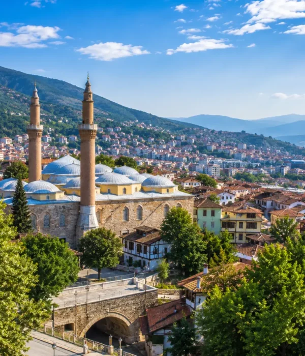 Bursa Turkey with Grand Mosque, green mountain scenery, Ottoman architecture, and bright morning atmosphere.