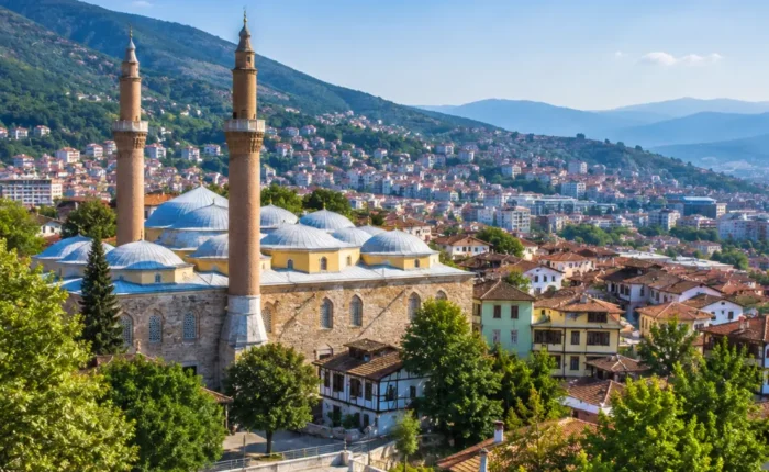 Bursa Turkey with Grand Mosque, green mountain scenery, Ottoman architecture, and bright morning atmosphere.
