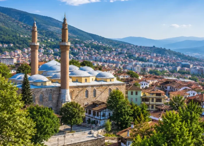 Bursa Turkey with Grand Mosque, green mountain scenery, Ottoman architecture, and bright morning atmosphere.
