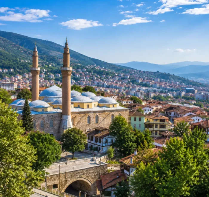 Bursa Turkey with Grand Mosque, green mountain scenery, Ottoman architecture, and bright morning atmosphere.