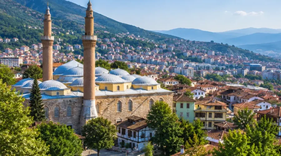 Bursa Turkey with Grand Mosque, green mountain scenery, Ottoman architecture, and bright morning atmosphere.
