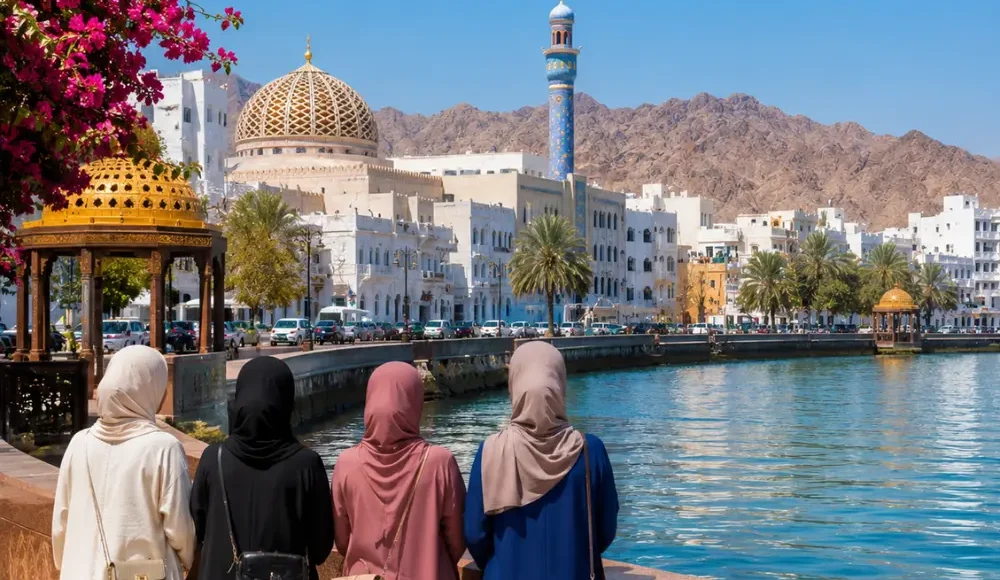 Women-only group enjoying the scenic Muscat Corniche with Sultan Qaboos Mosque and mountains in Oman
