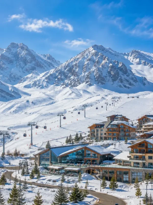 Shahdag Azerbaijan mountain resort with Caucasus peaks, green valley, luxury hotel, and bright morning atmosphere.