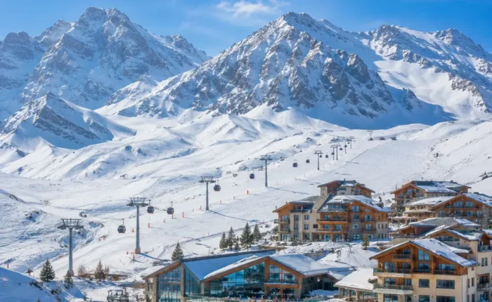 Shahdag Azerbaijan mountain resort with Caucasus peaks, green valley, luxury hotel, and bright morning atmosphere.