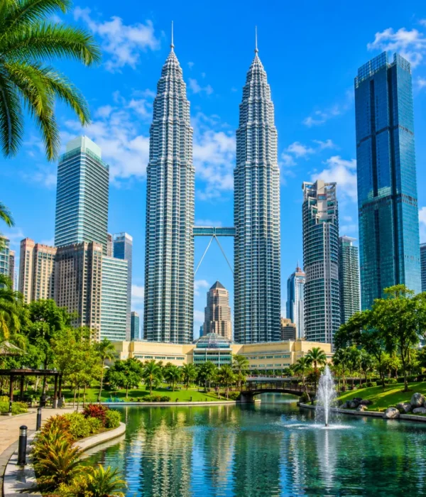 Ultra-clear square view of Kuala Lumpur with the Petronas Twin Towers, tropical greenery, and a premium modern cityscape.