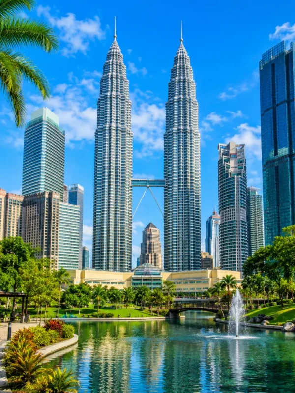 Ultra-clear square view of Kuala Lumpur with the Petronas Twin Towers, tropical greenery, and a premium modern cityscape.