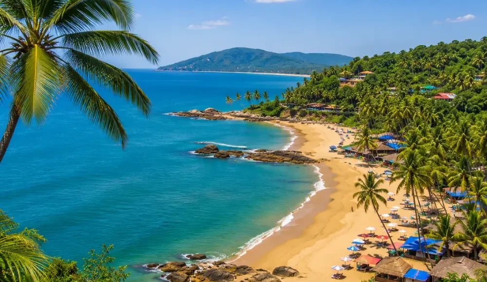 South Goa beach with soft golden sand, turquoise sea, coconut palms and peaceful clear morning coastal views.