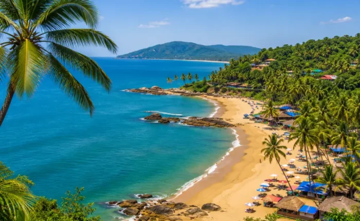 South Goa beach with soft golden sand, turquoise sea, coconut palms and peaceful clear morning coastal views.