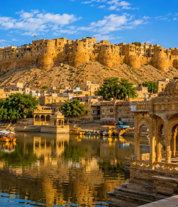 Jaisalmer fort with golden sandstone architecture, desert dunes and clear morning daylight in Rajasthan.