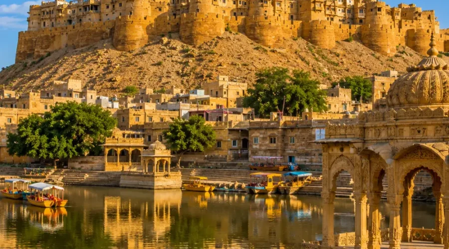 Jaisalmer fort with golden sandstone architecture, desert dunes and clear morning daylight in Rajasthan.