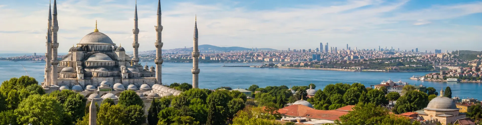 Turkey travel banner featuring Istanbul’s iconic Blue Mosque, lush cityscape, and panoramic Bosphorus waterfront under bright clear daytime skies.
